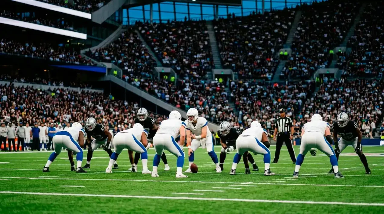 NFL match action under stadium floodlights with crowd silhouettes in the background