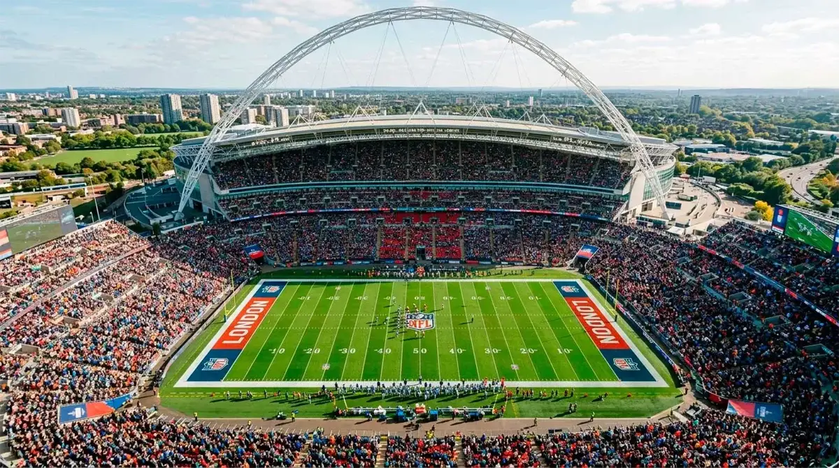 Wide view of Wembley Stadium during an NFL London Game with American football pitch markings and packed crowd